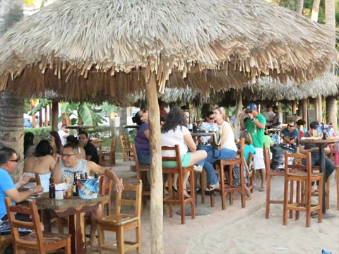 Joe's Oyster Bar seating area behind the volleyball court